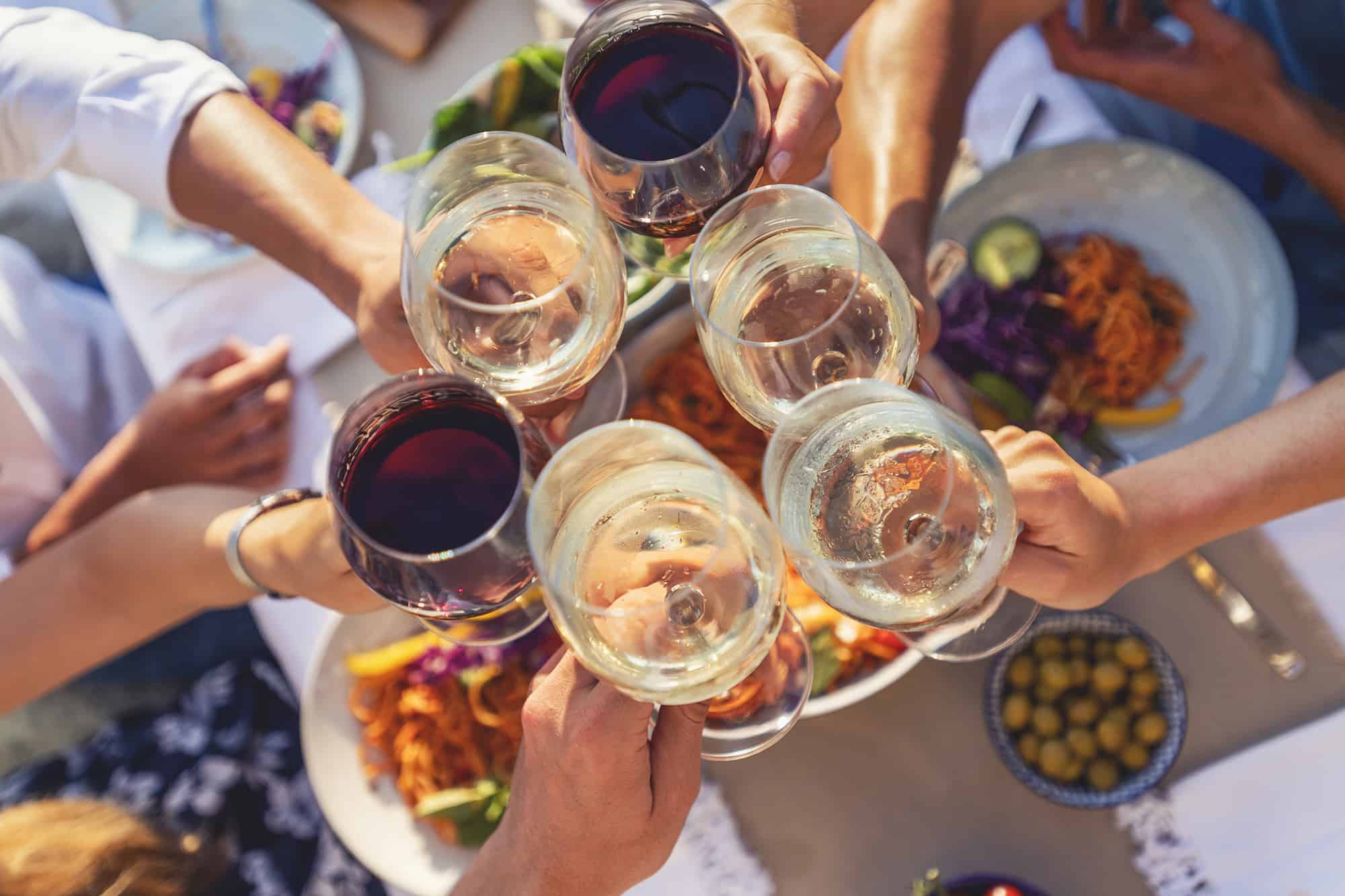 Group making a toast with wine