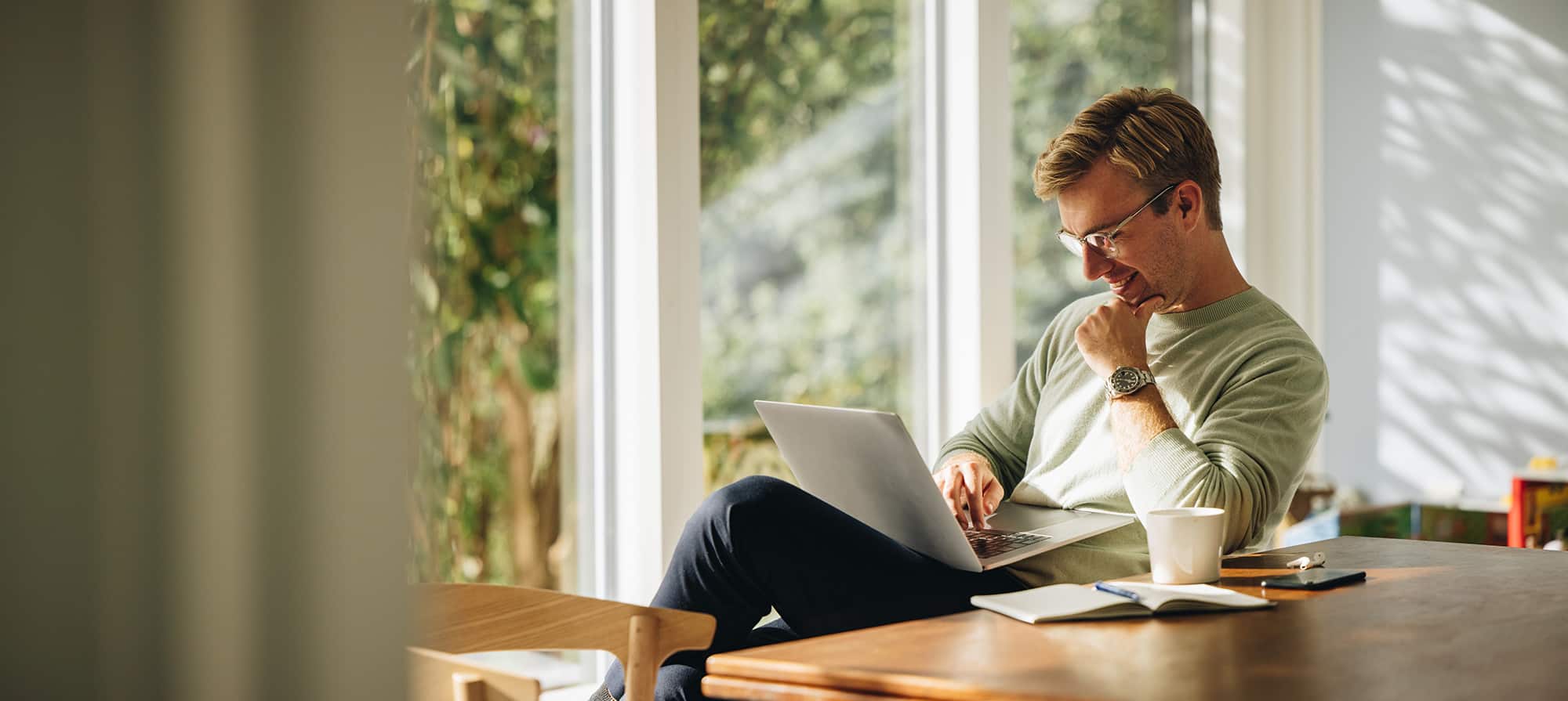 Man using laptop computer at home